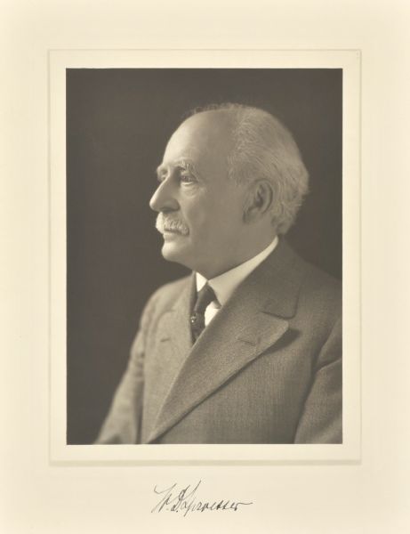 Quarter-length profile studio portrait of William D. Sproesser, Watertown merchant.