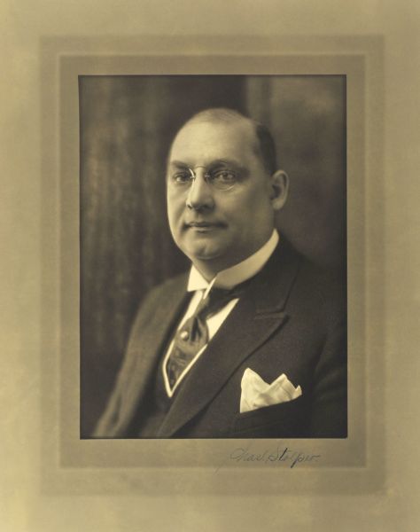 Quarter-length studio portrait of Charles Stolper, Milwaukee company president and treasurer.