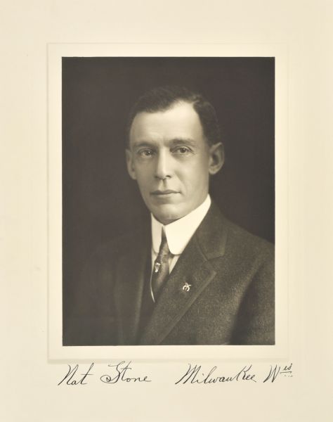 Quarter-length studio portrait of Nat Stone, Milwaukee merchant.