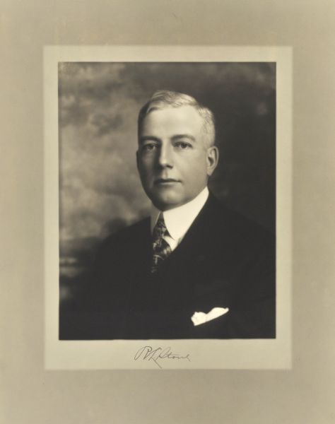 Quarter-length studio portrait of Roy L. Stone, Milwaukee banker.