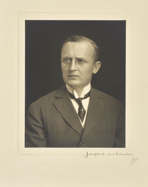 Quarter-length studio portrait of Joseph E. Uihlein, Milwaukee company president.