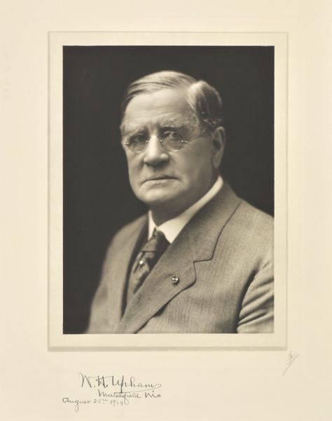 Quarter-length studio portrait of W.H. Upham, Milwaukee manufacturer.