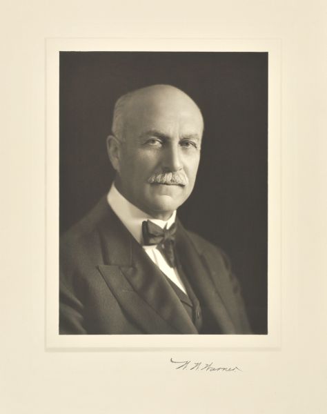 Quarter-length studio portrait of Wilber William Warner, Madison miner and merchant.