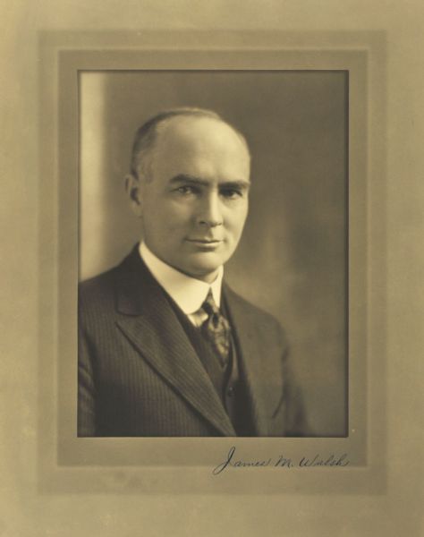 Quarter-length studio portrait of James M. Walsh, Milwaukee company president.