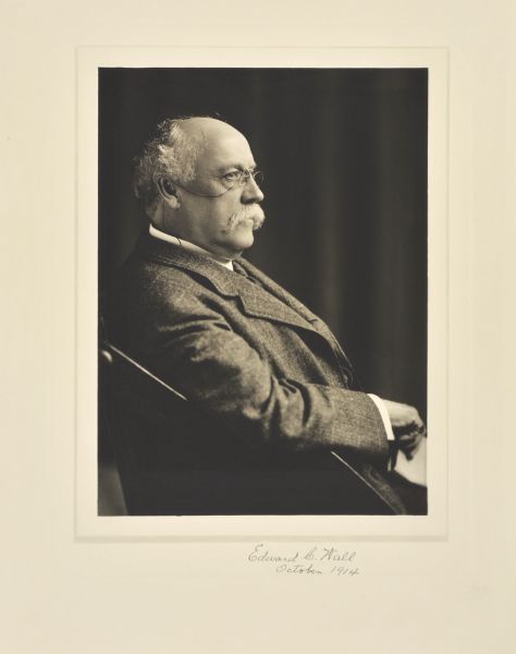 Waist-up seated studio profile portrait of Edward Clarence Wall, Milwaukee company president.