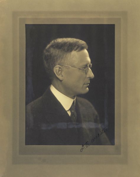 Quarter-length studio profile portrait of D.E. Webster, Milwaukee company manager.