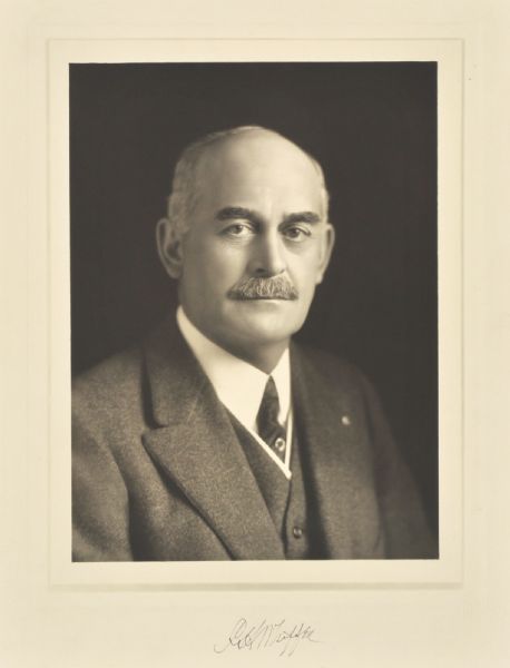 Quarter-length studio portrait of Charles H. Whiffen, Milwaukee company president.
