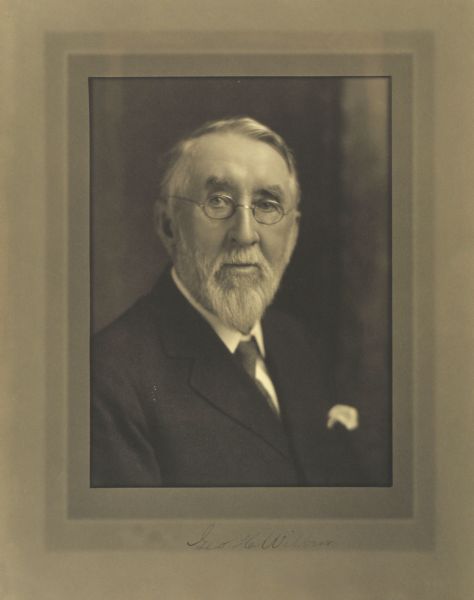 Quarter-length studio portrait of George H. Wilbur, Milwaukee lumberman.