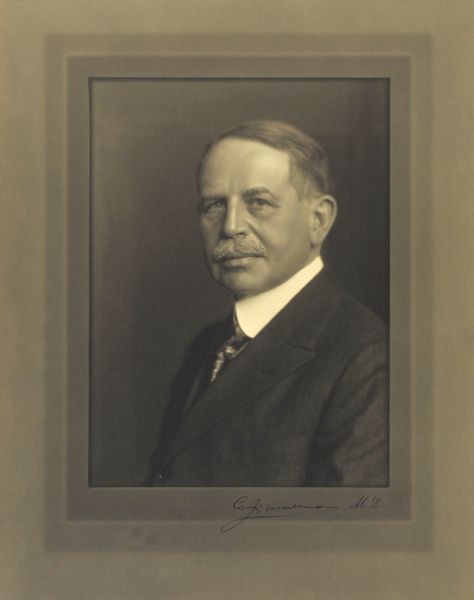 Quarter-length studio portrait of Charles Zimmermann, Milwaukee opthamologist.