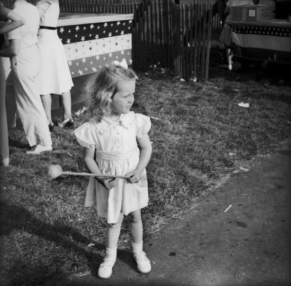 A little girl at a Civilian Defense Rally.