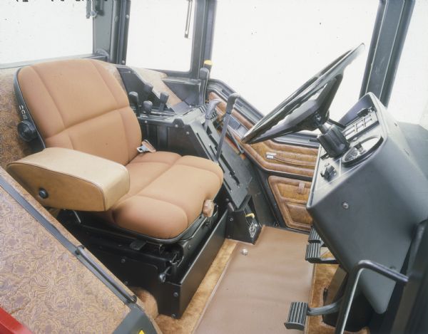 Color photograph of an International Harvester 3688 tractor with the optional "Western" interior.