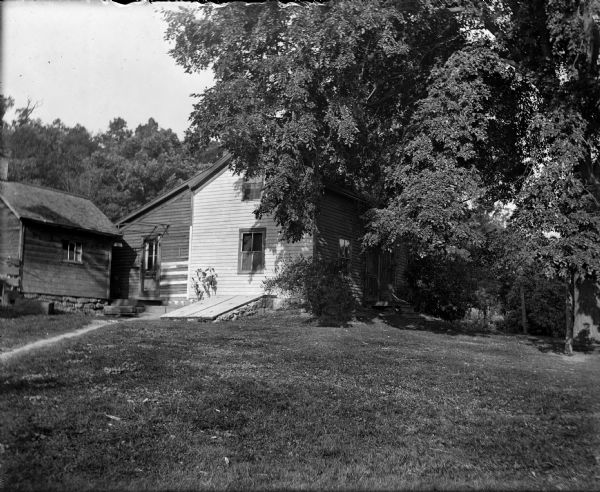 Exterior view from yard of Dr. Taylor's house, which was once a post office in the Town of Greenfield.