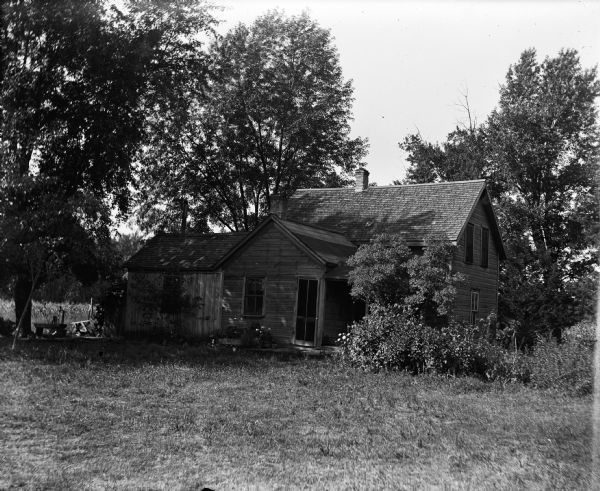 W.S. Pierce house under the shade of trees.