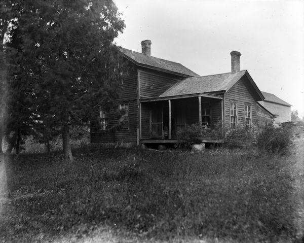 A wood frame house, with a porch, which was formerly the post office, owned by Mr. Edgar Wood, who was the postmaster.