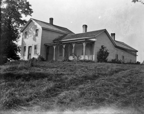 Exterior of Huntington House with large front porch.