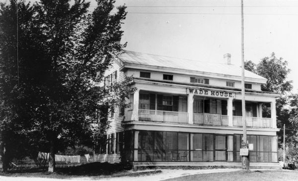 Front view of the Wade House. The Wade House, one of the earliest stagecoach inns in Wisconsin, was built between 1847 and 1851 by Sylvanus Wade. It became the most important stop on the plank road between Sheboygan and Fond du Lac.