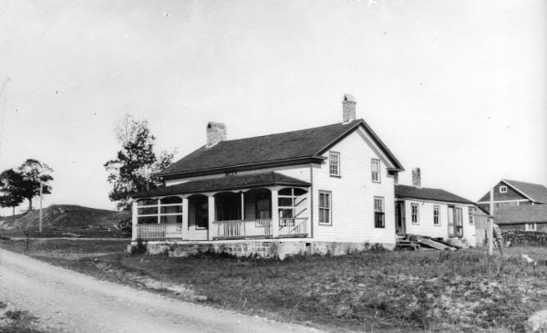 Wilson's Tavern, north of the point where the road from Black Hawk enters Trunk Highway 60. Built by John Wilson on Wilson Creek.
