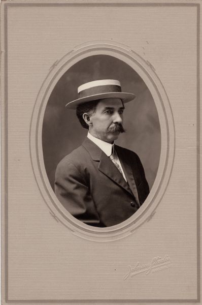 Quarter-length studio portrait of Harry Elsworth Cole (1861-1928), founder and first president of the Sauk County Historical Society, also president of the State Historical Society of Wisconsin. He was an organizer of the Wisconsin Archeological Society. Cole was the editor of the <i>Baraboo News</i>, as well as an author and photographer.