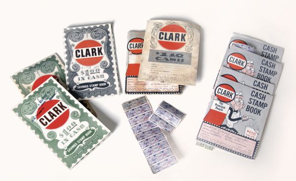 Assortment of Clark stamp books and stamps.