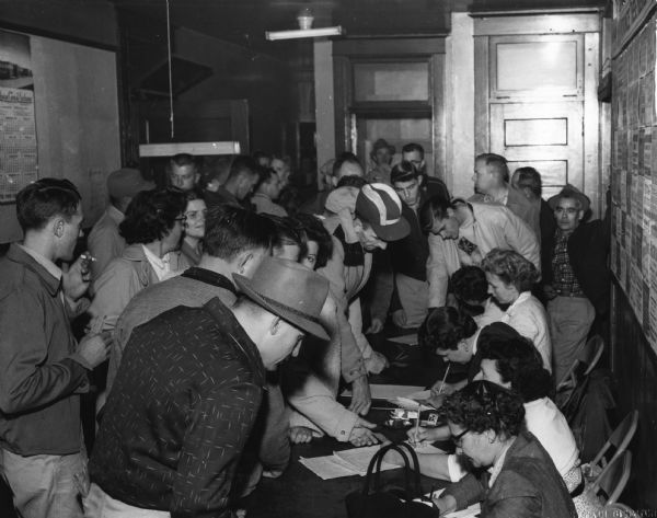 Members of Local 167 of the United Packinghouse Workers of America employed by the Swift Company in South St. Paul signing up for strike duty.