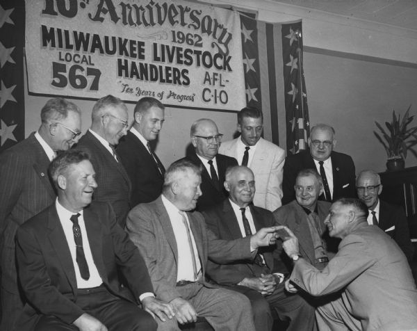 Members of Milwaukee Livestock Handlers, Local 567 of the Amalgamated Meatcutters and Butcher Workers Union, celebrate their 10th anniversary.