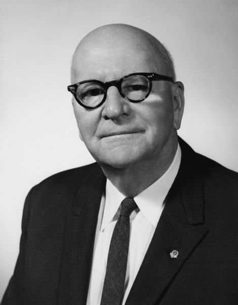 Three-quarter length studio portrait of Oscar G. Mayer (1888-1965). He was president and chairman of the board of Oscar Mayer & Co., the firm founded by his father, Oscar F. Mayer.