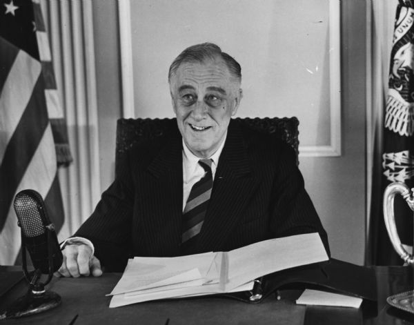 President Franklin D. Roosevelt smiles as he concludes his 1945 radio state of the nation address.