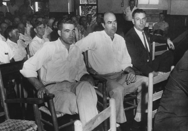 Roy Bryant, and his half-brother J.W. Milam, (left to right) with their attorney on the opening day of their trial for the murder of Emmett Till. The 14-year-old Till, an African American visitor from Chicago, had allegedly whistled at Bryant's wife. The two men were acquitted.