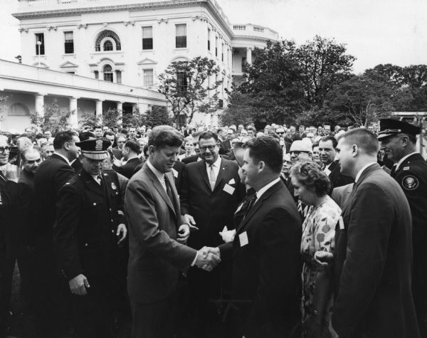 President John F. Kennedy greets members of the Amalgamated Meat Cutters and Butcher Workers union who were in the capitol for a COPE conference.