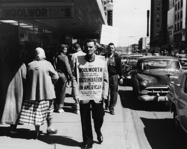 Members of a Des Moines United Packinghouse Workers of America local picket outside a Woolworth's store to demonstrate their opposition to segregation of Woolworth stores in the South. The UPWA had a long record of support for the rights of African American workers, and it was one of the few unions to attempt to organize black workers.