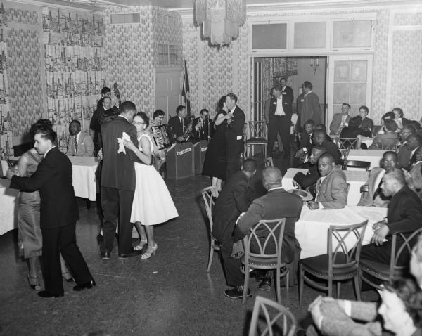 Dance sponsored by the Women's Activities Committee of Local 13 of the United Packinghouse Workers of America union. Although the location is unidentified, Local 13 was based in Oklahoma City.