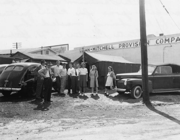 Two representatives of the Georgia CIO, C.H. Gillman and Loren Nelleo, visiting with strikers at the Swift company's White Provisions plant. The strikers were members of United Packinghouse Workers of American Local 108.