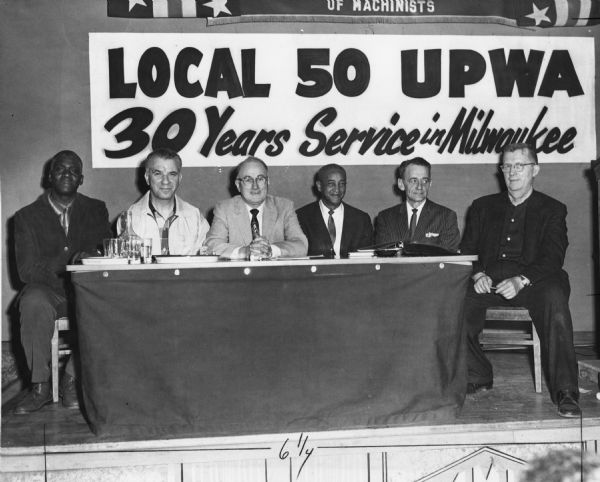 Members of the United Packinghouse Workers of America Local 50 at a ceremony marking the closure of the Swift & Company plant in Milwaukee. The local was organized about 1932 by the Amalgamated Meat Cutters, but it left to join the CIO's UPWA when that union was formed in 1937. The men are (left to right) Felix Wright, John Maren, Eddie Hampton, Calvin Birts, Henry Schroeder (president), and Emil Sobstad.