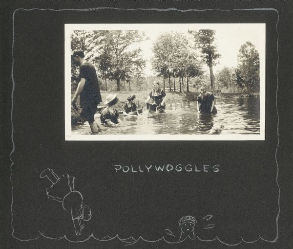 Several women and one man wade in Lake Flora Dell. Delia Drew King is second from left, in a white straw hat. A hand-drawn caption beneath the photograph reads, "pollywoggles," in addition two cartoon figures swimming.