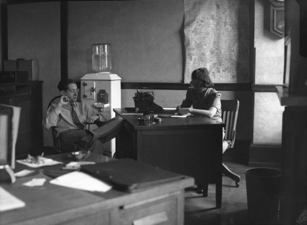 Bloch rented an office and a secretary so that he could dictate and complete eight stories. It was short-lived. Gauer's caption: Dictator, Water Cooler, Secretary.