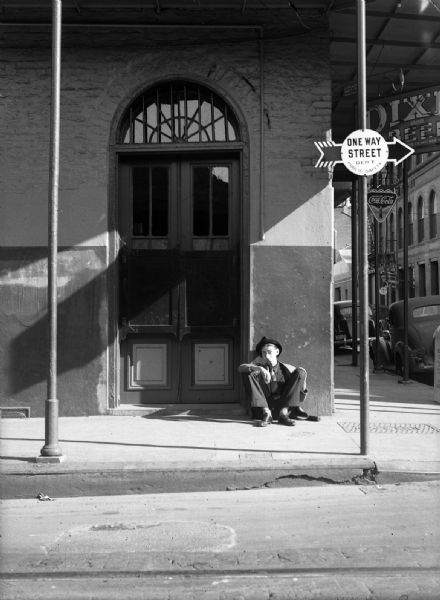 View across street of Robert Bloch posing as a drunk in New Orleans, during Gauer and Bloch's trip there to write a book.