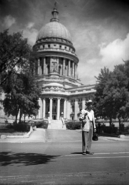 Gauer in Madison in front of the Wisconsin State Capitol after speaking with the Governor on CARE business.