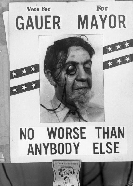 Political poster of Gauer in costume as a candidate for mayor, taken post-Zeidler campaign. Gauer says his motto was: "...clean city hall of deadwood and replace them with relatives."