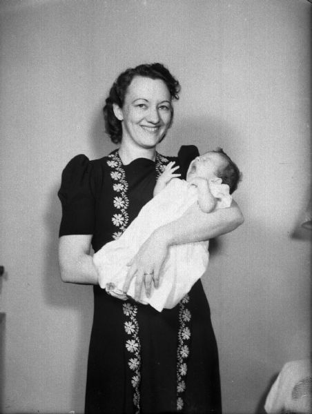 Formal portrait of Marion Bloch with baby Sally Ann.