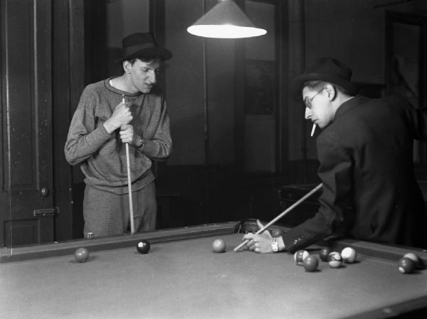 Milt Gelmand and Robert Bloch play a humorous game of pool. From a set of pictures that was eventually sold to <i>Cheers</i> humor magazine.