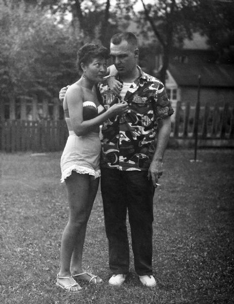 Couple posing outside. Harold Gauer's brother Norman with his "exotic oriental" dance wife, Wong Lee.