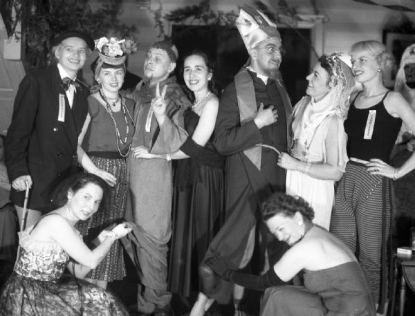 Gauer and friends in costume at a party. In the back row from left to right are Angie Vail, Ruth Distenfeld, Bob Vail, Mary Jo Vonier, Harold Gauer, Ruth Collier, and an unidentified woman. Alice Bedard is on the far right in front, and the woman on the left is unidentified.