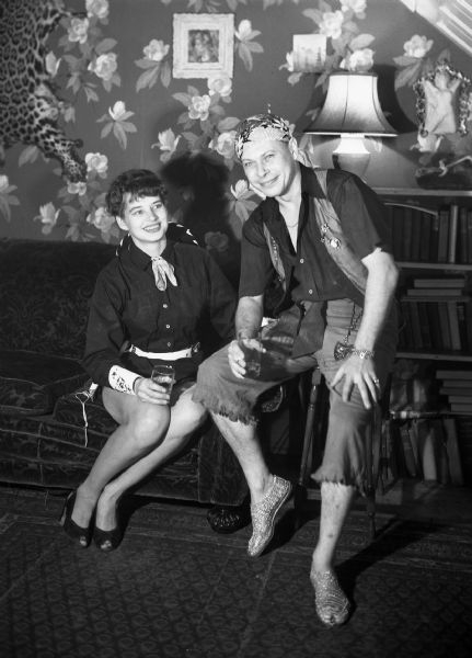 Robert and Angie Vail pose with drinks at a nautical themed costume party.