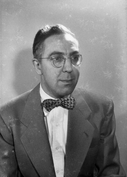 A self-portrait of Harold Gauer wearing a jacket and bow tie.