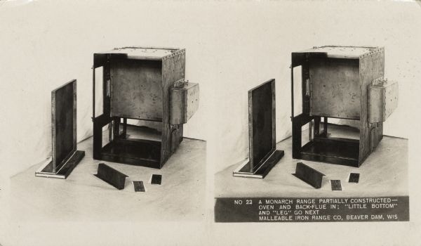 A partially constructed Monarch range on display. Caption on stereograph reads, "No. 22 A Monarch range partially constructed oven and back-flute in; 'little bottom' and 'leg' go next. Malleable Iron Range Co, Beaver Dam, Wis."