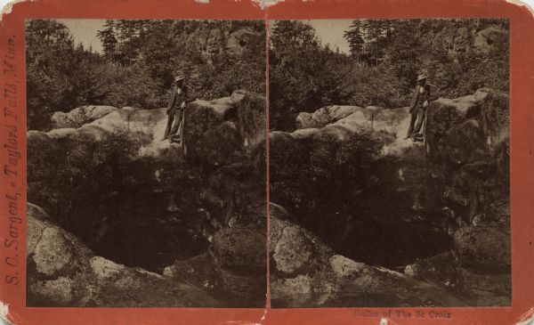 A man is standing above a large pothole carved from the rock by a glacier. Caption on stereograph reads: "Dalles of the St. Croix." This is at Interstate park which became a state park in 1900 on the Minnesota side of the river and the first state park in Wisconsin in 1900.