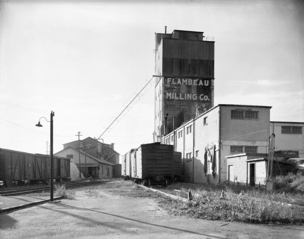 View from railroad tracks of the Flambeau Milling Company Plant.