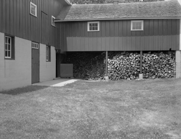 View of a barn and woodshed on Mr. Conrad Breunig's farm.