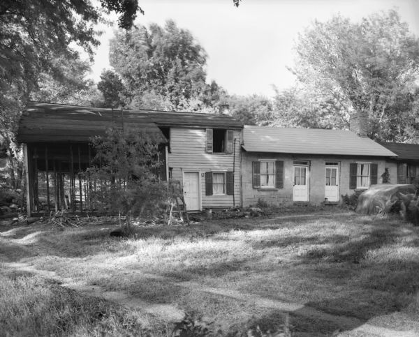 A row of historical homes, once owned by Cornish miners. Purchased by Robert Neal, the house on the left is undergoing restoration. Mr. Neal has also restored several other nearby properties.