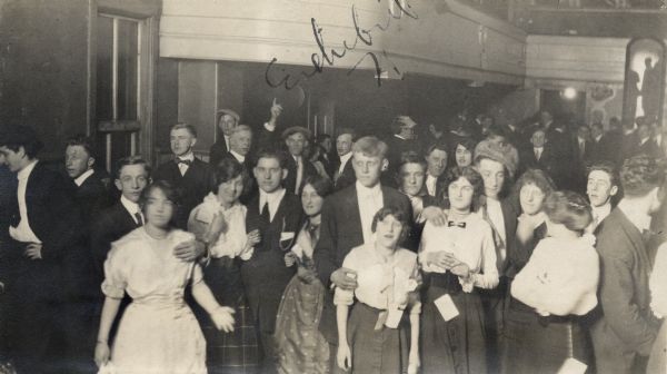 A group of people, including minors, in a saloon dance hall at 2 a.m. in Milwaukee. The dance hall, Vizey's Hall, was on 8th Street and Walnut. Liquor was being sold at the two bars, one on the second floor and one in the basement.